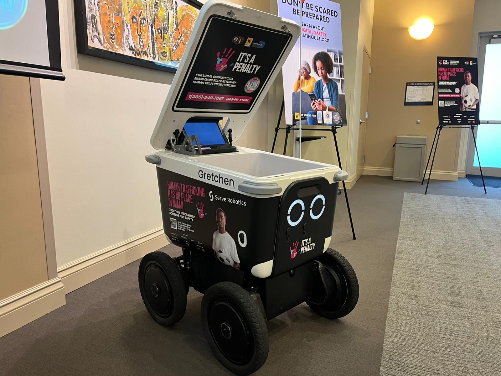 Serve Robotics delivery robot wrapped in It's a Penalty messaging